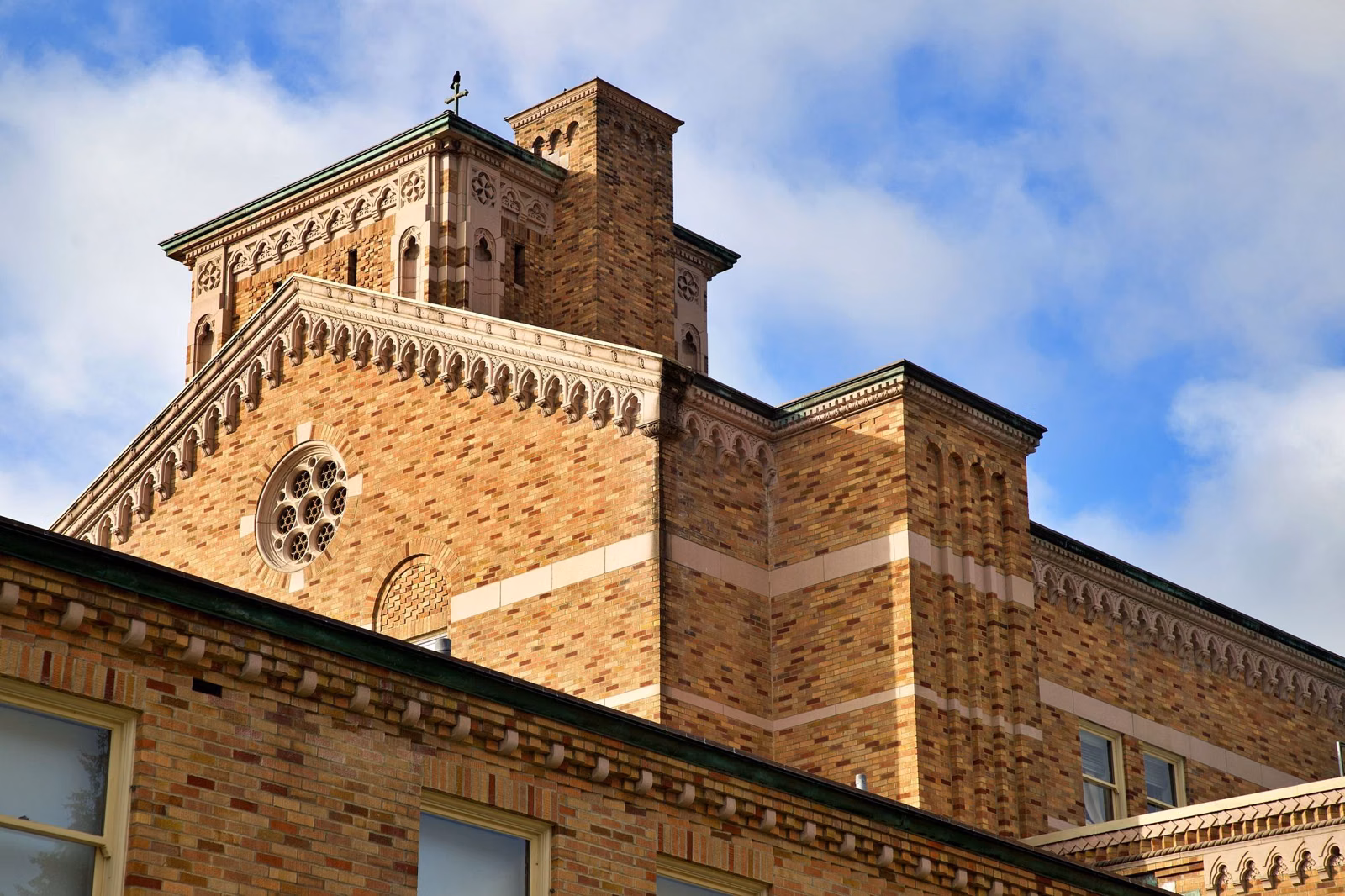 The brick Saint Edward seminary building in early morning light